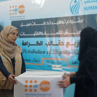 Distributing dignity kits in Taiz and organizing a bazaar in Marib